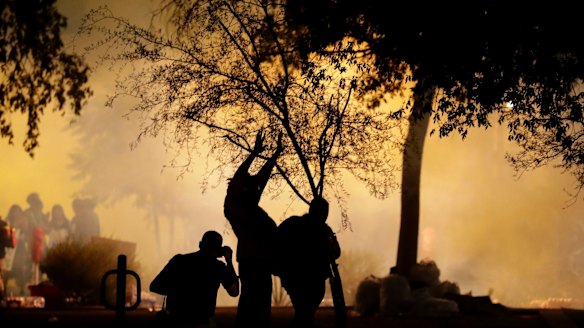 Tear gas engulfs protesters outside the Phoenix Convention Centre, while inside Trump lashed out at the media and his own party.