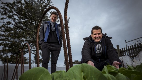 Rebecca Scott of STREAT and Rob Rees of Cultivating Community, pictured in the Collingwood Children's Farm garden beds that will be producing food for those in need.