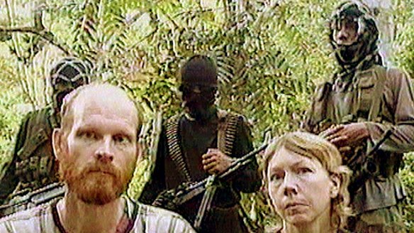 Long history of hostage-taking ... US missionaries Martin and Gracia Burnham are guarded by Abu Sayyaf Islamists on March 7, 2002.
