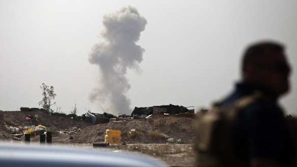Smoke rises from an Islamic State car bomb on the front line in Fallujah.