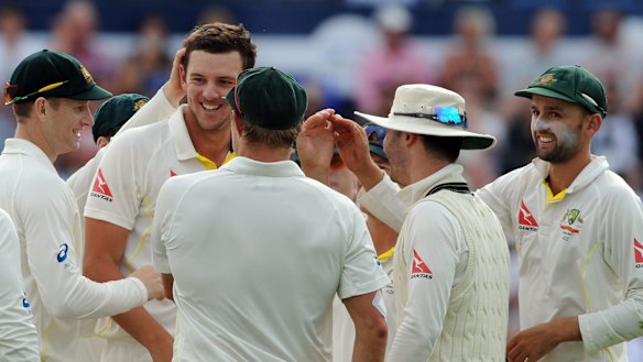 Australia's Josh Hazlewood (second from left) is congratulated on his superb outfield catch to remove England's Stuart Broad late on day three of the first Ashes Test in Cardiff.