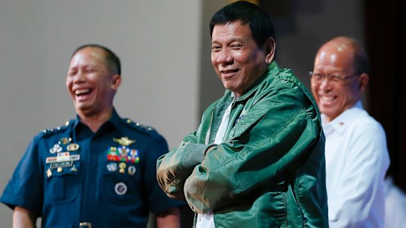 Philippines President Rodrigo Duterte wears a pilot's jacket presented to him during a visit to Air Force headquarters in Pasay, Philippines, earlier this month.