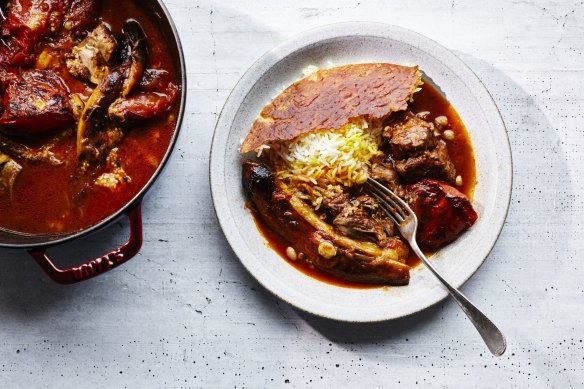 Khoresh-e bademjoon, or Iranian eggplant and tomato stew (pictured with tahdig, or Persian rice).