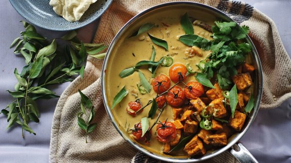 Vibrant vegan sweet potato, cherry tomato and tamarind curry.