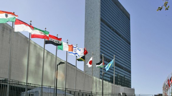 Flags of member nations flying outside United Nations headquarters in New York. 