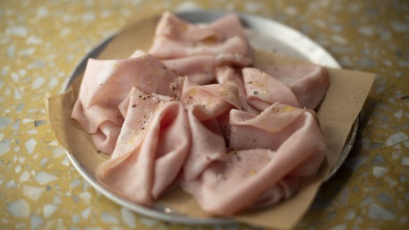 Start ticking small plates of antipasti: Soft, peppery mortadella.