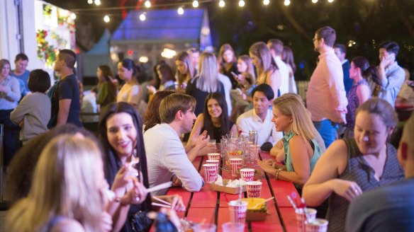 Market goers enjoy the atmosphere of the Night Noodle Markets.