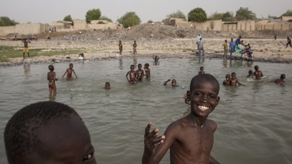 Children play by the river in Maiduguri, Nigeria. 