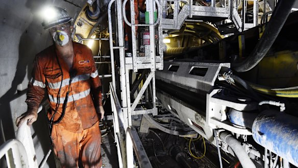 A worker in the tunnel of the north-west rail link.