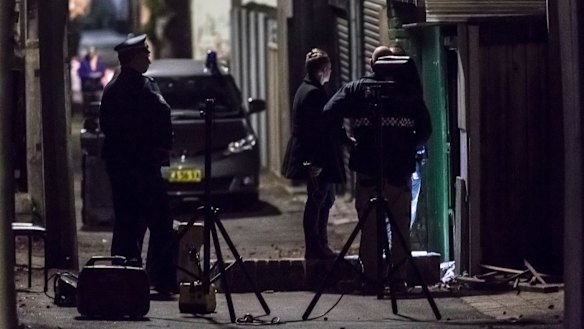 Police at the scene of the raid in Surry Hills on Saturday.