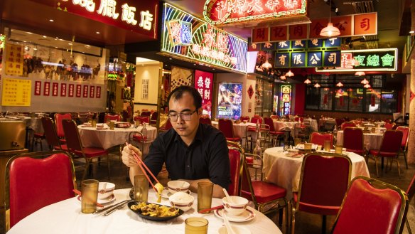 Table for one: Good Luck Hot Pot manager Jack Chen is pleading for people to keep supporting Chinese restaurants. 