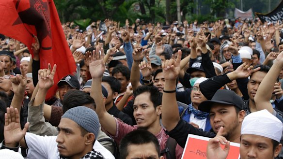 Indonesian Muslims shout "Allahu Akbar' (God is great) during a rally to denounce the decree in Jakarta on Tuesday. 