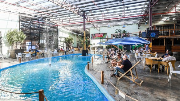 Moon Dog World features a public-pool-blue lagoon with a fountain.