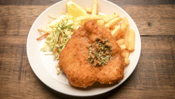 Chicken schnitzel with garlic butter, chips and fresh fennel slaw. 