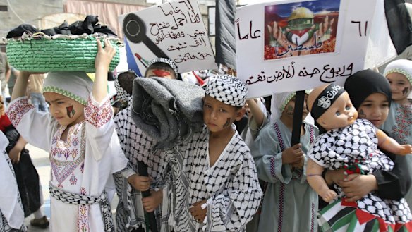 Palestinian children re-enact the Nakba  in the Palestinian refugee camp of Ain al-Hilweh in Lebanon in 2009.