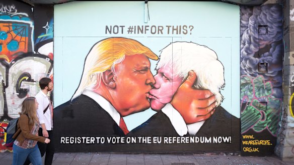 A mural that has been painted on a derelict building in Stokes Croft showing Donald Trump sharing a kiss with Boris Johnson.