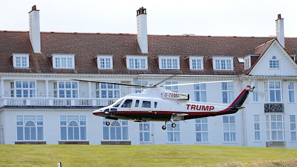 Trump arrival: Reporters were limited to questions about golf while Trump was at his golf course in Scotland on Friday. 
