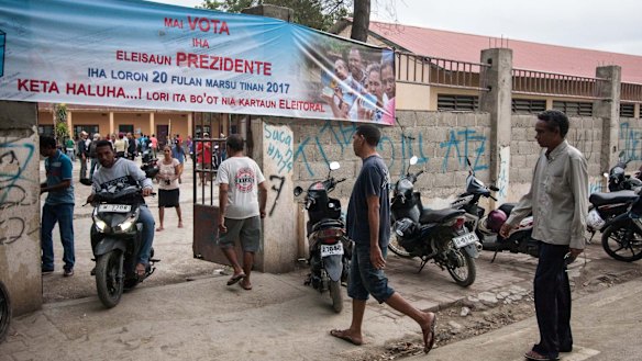 Voters enter a polling booth in Dili, East Timor, on Monday.