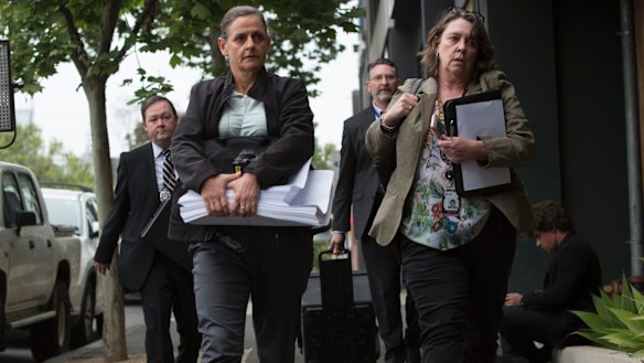 AFP officers enter the Melbourne headquarters of the AWU in Spencer Street.