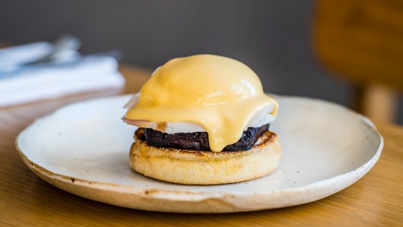 Clayton Wells serves his version of eggs benny with black pudding.