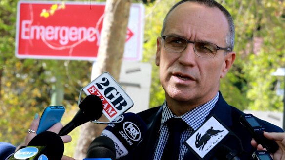 Sad situation: South Sydney CEO John Lee addresses the media at St Vincent's Hospital. 