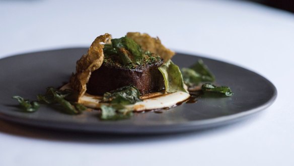 Eye fillet is poached sous vide in a sugary stock, then cooked in a pan.