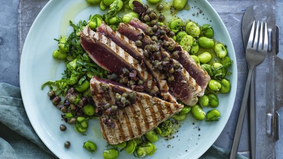 Barbecued tuna steaks with broad beans and roughly chopped  tapenade.