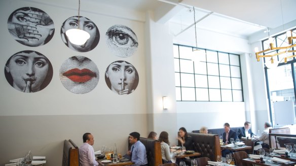 Fornasetti wallpaper makes a striking feature at Massi in Melbourne.