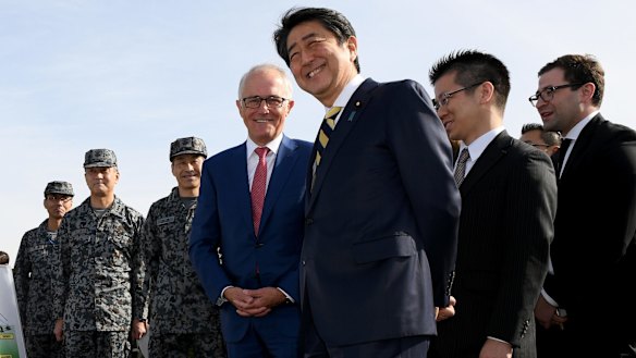 Australian Prime Minister Malcolm Turnbull and Japanese Prime Minister Shinzo Abe inspect the Patriot Missile system and Australian made Bushmaster Protected Mobility vehicle at a Japan Ground Self Defence Force base at Narashino, Japan.