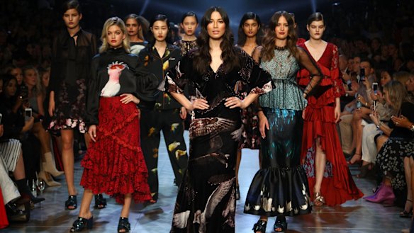 David Jones ambassadors Jessica Gomes (centre) and Jesinta Franklin (right), and model Megan Irwin (left) in the finale of the Gala Runway at the Melbourne Fashion Festival on Tuesday night.