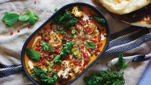 Cauliflower steaks swimming in coconut saffron curry.