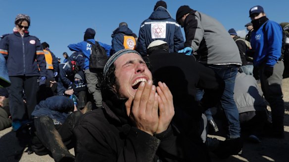 A settler reacts as police evict the last settlers from the West Bank outpost of Amona on Thursday.