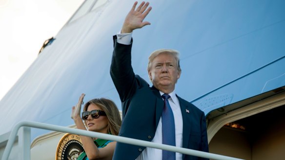 Trump and first lady Melania Trump board Air Force One at Joint Base Pearl Harbor Hickam, Hawaii, en route to Japan.