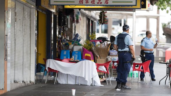Police draped a white sheet over two of the chairs to shield Mr Ledinh's body from onlookers.