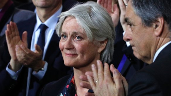 Penelope Fillon, wife of conservative presidential candidate Francois Fillon, right, reacts during a campaign meeting in Paris, on Sunday.