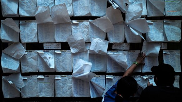 Voting lists blowing in the breeze at a polling station in Manila.
