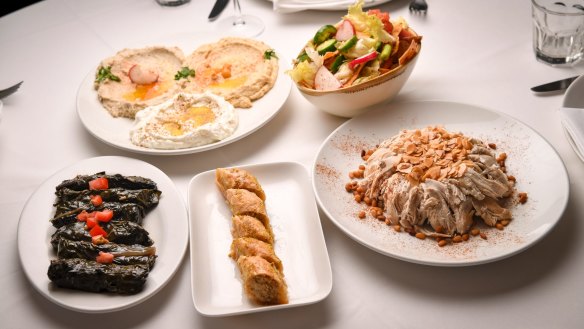 A selection of home-style Lebanese dishes at Abla's including mixed dips, fattoush, chicken and rice, baklava and silverbeet rolls.