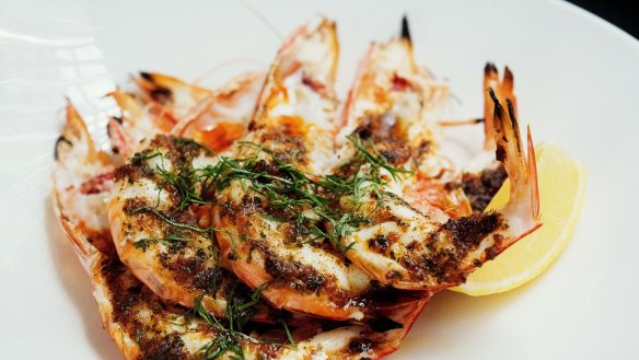 There are plenty of reasons to spend a long lunch at Rockpool Bar & Grill - such as the charcoal roast king prawns at Neil Perry's old-school steakhouse.
