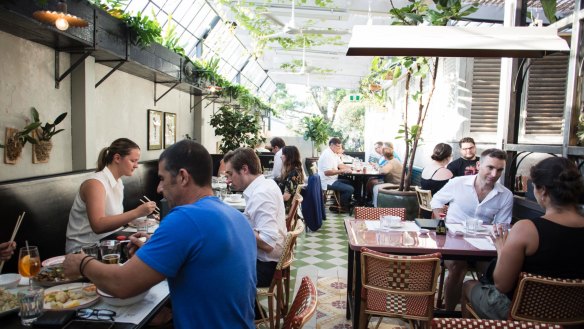 Keep your shades on at a table on the steamy tropical terrace.