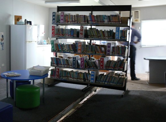 The library's books were saved after a gap opened between the two buildings, which were previously connected, allowing the water to gush out. 