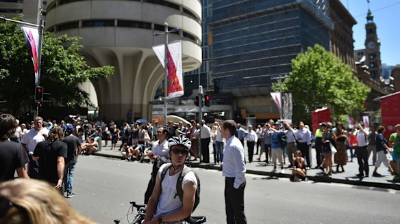 Workers gather at Martin Place during the siege at the nearby Lindt cafe. 