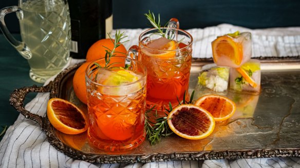 Aperol spritz with champagne, blood orange and rosemary.