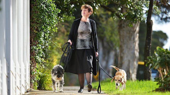 Retiring Labor MP Anna Burke walking her dogs Max and Pippy.