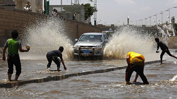 Boys play in floodwaters after heavy rain in Sanaa last week. 