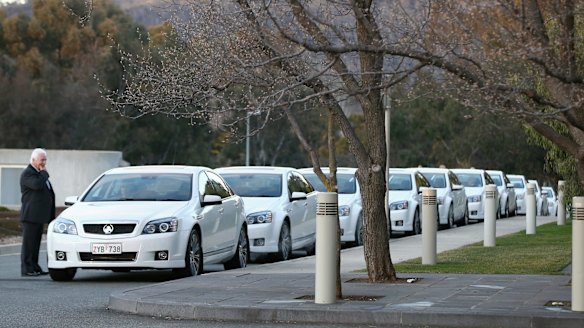 COMCARS line up outside the House of Representatives.