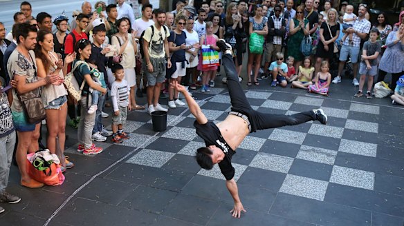 We're the best: The Young Masters break-dancing crew perform in Swanston Street.
