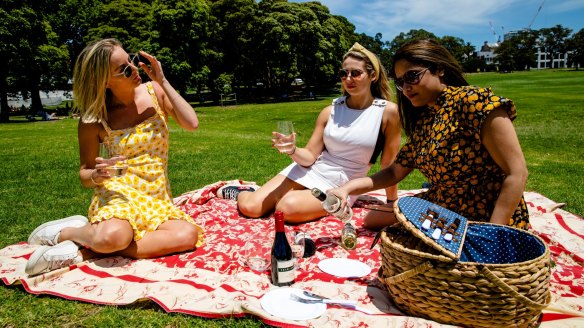 Friends having a picnic in Prince Alfred Park, Sydney.