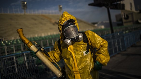 A worker fumigates the Sambadrome ahead of Carnival celebrations in Rio de Janeiro.