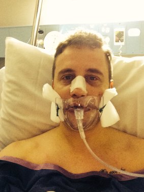 Michael Harris in hospital after the alleged assault.