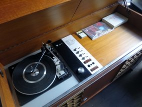 The 1960s record player can't be lifted by one person alone.